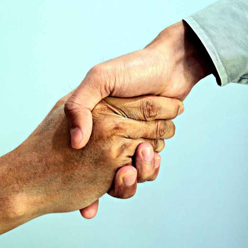 Building community and connection. Shaking hands, introductions and networking.